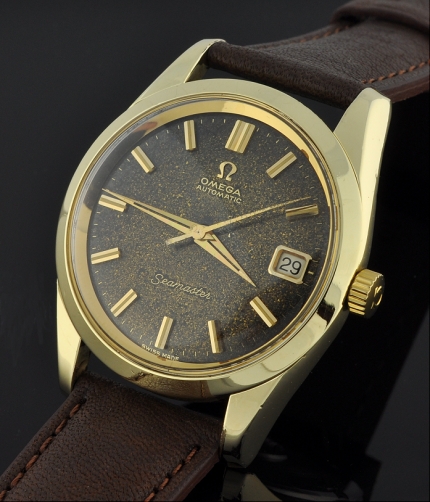1963 Omega Seamaster gold-capped watch with original case, sea-monster back, wide bezel, suntanned dial, and cleaned caliber 562 movement.
