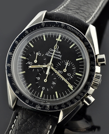 1973 Omega Speedmaster stainless steel chronograph watch with original moon case back, lugs, hesalite crystal, and caliber 861 movement.