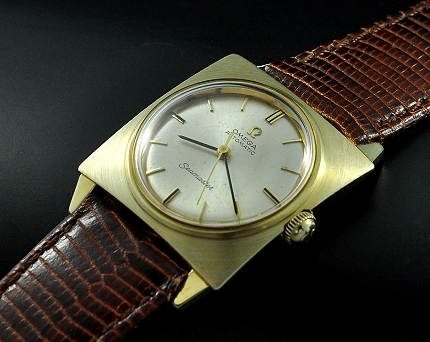 1966 Omega Seamaster 14k solid-gold watch with original square screw-back case, winding crown, and cleaned automatic winding movement.