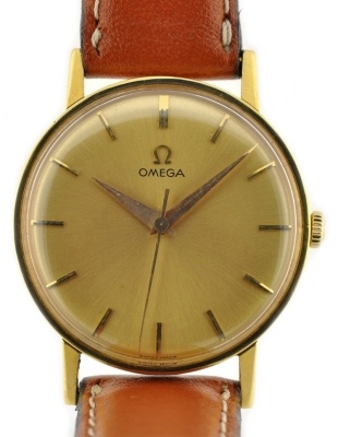1961 Omega 18k solid-gold watch with original scratchless case, narrow bezel, dial, Dauphine hands, and caliber 600 manual winding movement.