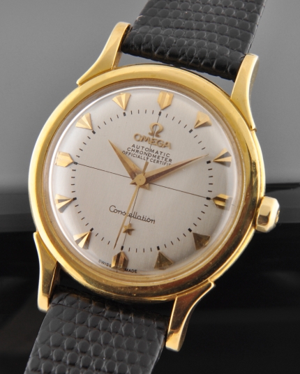 1954 Omega Constellation 18k gold watch with original winding crown, restored dial, Dauphine hands, and caliber 354 automatic movement.