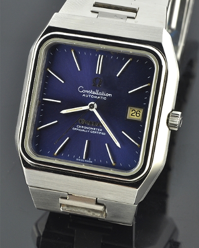 1970s Omega Constellation large stainless steel watch with original bracelet, square-shaped case, blue dial, and cleaned automatic movement.