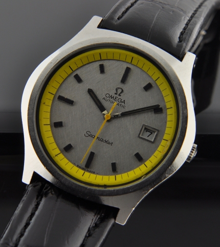 1971 Omega Seamaster stainless steel watch with original crosshatch silver dial, yellow inner bezel, and caliber 1002 automatic movement.