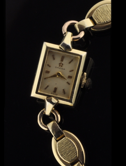 1960 Omega gold-plated ladies cocktail watch with original dial hands, signed winding crown, and cleaned, accurate manual winding movement.