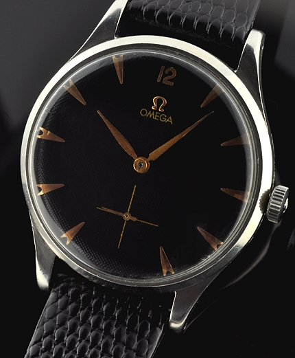 1950 Omega stainless steel oversized watch with original case, black dial, arrow markers, lance hands, and cleaned caliber 265 movement.