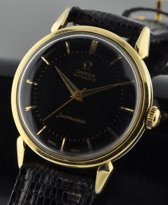 1954 Omega Seamaster gold-filled watch with original restored black dial, markers, Dauphine hands, sweep seconds, and caliber 471 movement.