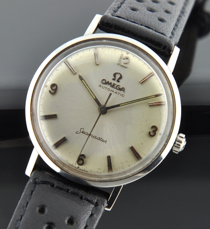 1960s Omega Seamaster stainless steel watch with original simple layout, all-dial appearance, and 34mm sea-monster-logo case.