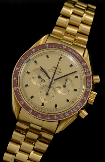 1969 Omega Speedmaster 18k solid-gold chronograph watch with original case, bracelet, bezel insert, crown, hands, and caliber 861 movement.