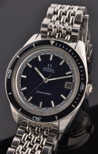 1970 Omega Seamaster 60 stainless steel dive watch with original beads-of-rice bracelet, winding crown, blue dial, and caliber 565 movement.