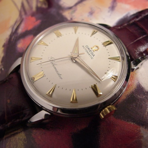 1958 Omega Globemaster stainless steel watch with original winding crown, Explorer-style dial, Dauphine hands, and caliber 501 movement.