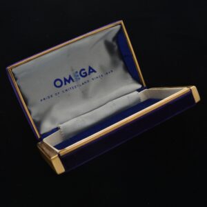 Here is an uncommon 1950s deep-purple Omega velvet and metal-edged vintage watch box measuring 2.75x4.5".