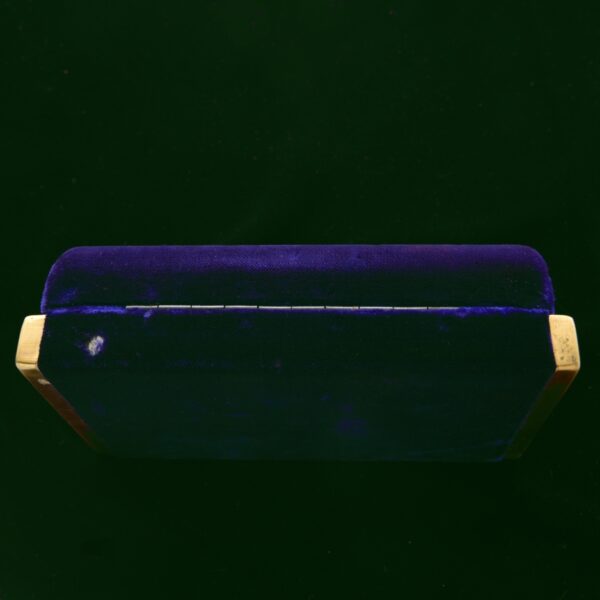 Here is an uncommon 1950s deep-purple Omega velvet and metal-edged vintage watch box measuring 2.75x4.5".
