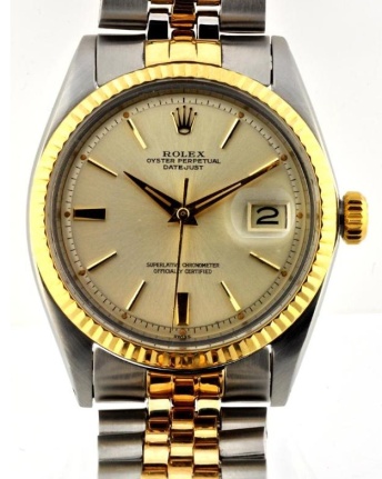 1963 Rolex Oyster Perpetual Datejust stainless steel watch with original bracelet, gold bezel, generation dial, and caliber 1580 movement.