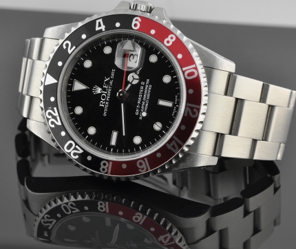 2000 Rolex Oyster Perpetual GMT-Master II stainless steel watch with original coke bezel, case, black dial, and clean caliber 3185 movement.