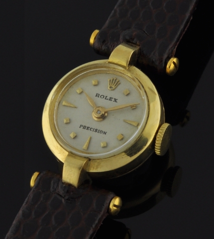 1951 Rolex Precision 18k solid-gold cocktail watch with original T-bar lugs, restored dial, markers, hands, and manual winding movement.