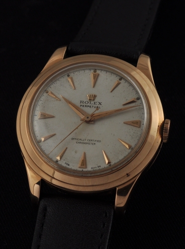 1940s Rolex Perpetual 18k rose-gold watch with original French hallmarked case, dial, markers, hands, and cleaned A296 bubbleback movement.