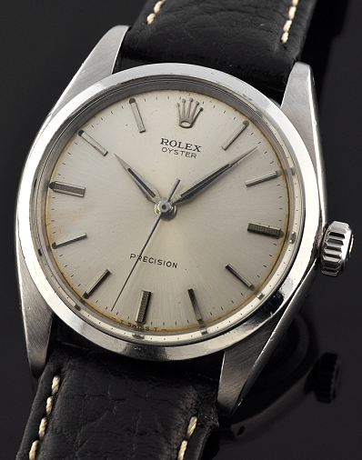 1967 Rolex Oyster Precision stainless steel watch with original silver dial, Dauphine hands, narrow bezel, and manual winding movement.