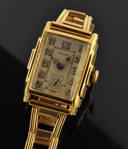 1940 Rolex Standard gold-plated watch with original cathedral hands, lume, Arabic numerals, bracelet, and cleaned manual winding movement.
