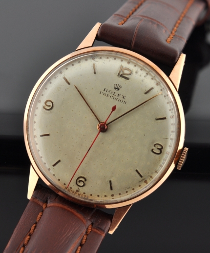 1944 Rolex Precision stainless steel watch with original rose-gold bezel, Arabic markers, modern hands, and cleaned manual winding movement.