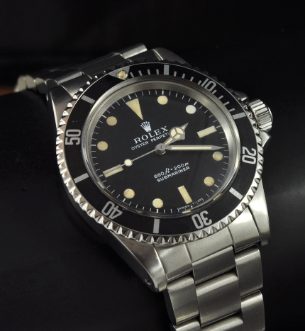 1970 Rolex Oyster Perpetual Submariner stainless steel watch with original polished case, fat-font bezel, and clean caliber 1520 movement.
