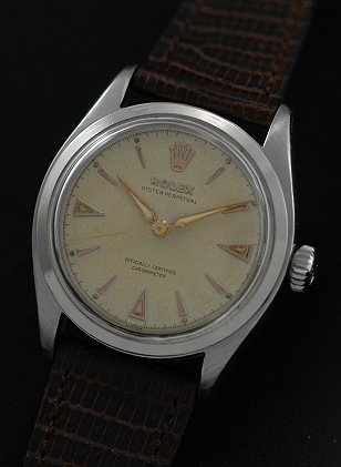 1953 Rolex Oyster Perpetual stainless steel watch with original Brevet winding crown, dial, case, and cleaned semi-bubbleback movement.