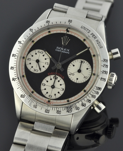 1965 Rolex Cosmograph Daytona stainless steel Paul Newman chronograph watch with original black dial, bracelet, and clean Valjoux movement.