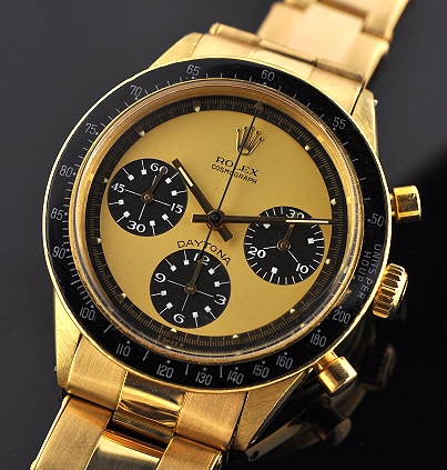 1967 Rolex Cosmograph Daytona 18k gold watch with original Paul Newman dial, bracelet, bezel, and clean, accurate Valjoux 727 movement.
