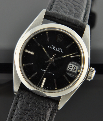 1982 Rolex Oysterdate Precision stainless steel watch with original black dial, baton hands, and recently cleaned manual winding movement.