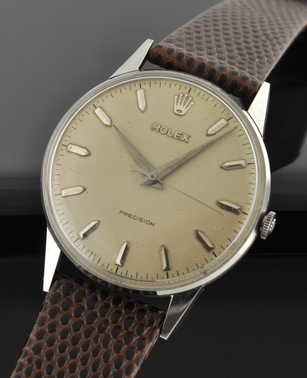 1956 Rolex Precision stainless steel watch with original Oyster bracelet, Dauphine hands, sweep seconds, waffle dial, and manual movement.