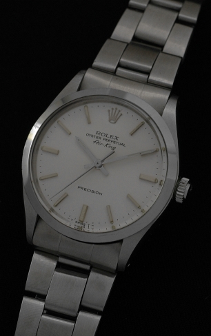 1983 Rolex Oyster Perpetual Air-King Precision stainless steel watch with original folded bracelet, silver dial, and automatic movement.