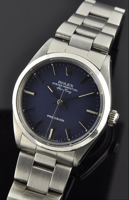 1988 Rolex Oyster Perpetual Air-King Precision stainless steel watch with original blue dial, scratchless bracelet, and automatic movement.