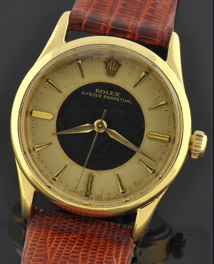 1958 Rolex Oyster gold-plated watch with original bullseye dial, Dauphine hands, sweep seconds, and cleaned automatic winding movement.