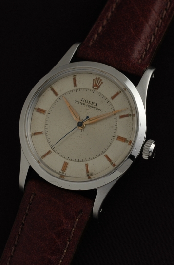1955 Rolex Oyster Perpetual stainless steel watch with original bullseye two-toned dial, markers, Dauphine hands, and caliber 1030 movement.