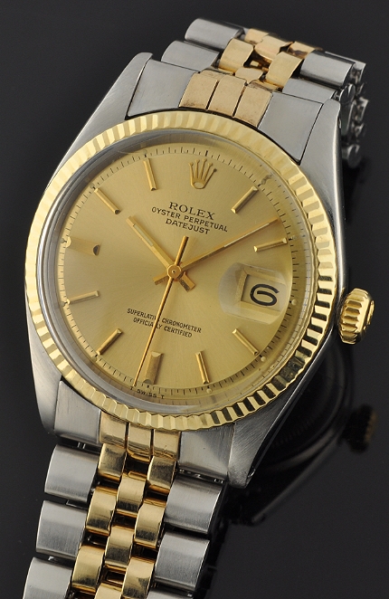 1973 Rolex Oyster Perpetual Datejust stainless steel watch with original two-tone bracelet, case, gold bezel, and clean automatic movement.