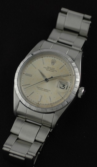 1959 Rolex Oyster Perpetual Datejust stainless steel watch with original crenelated bezel, riveted bracelet, and caliber 1066 movement.
