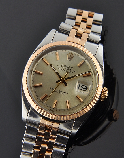 1966 Rolex Oyster Perpetual Datejust stainless steel watch with original rose-gold crown, bezel, dial, and clean automatic winding movement.
