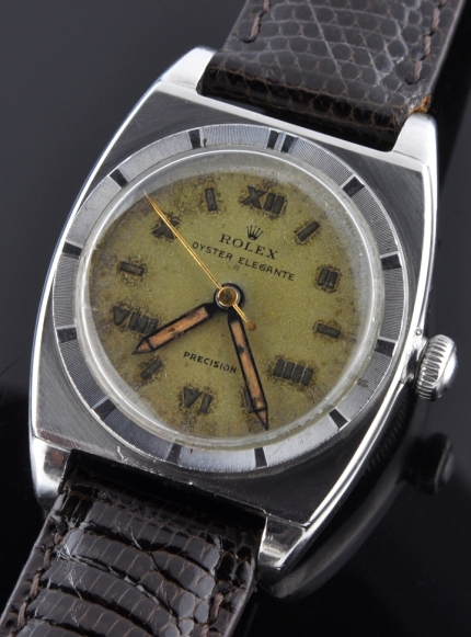 1948 Rolex Oyster Elegante stainless steel watch with original engine-turned bezel, dimple crown, dial, and cleaned manual winding movement.