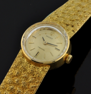 1970 Rolex Precision 18k solid-gold watch with original 6.6" integrated bracelet, mineral-glass crystal, snap buckle, and cleaned movement.