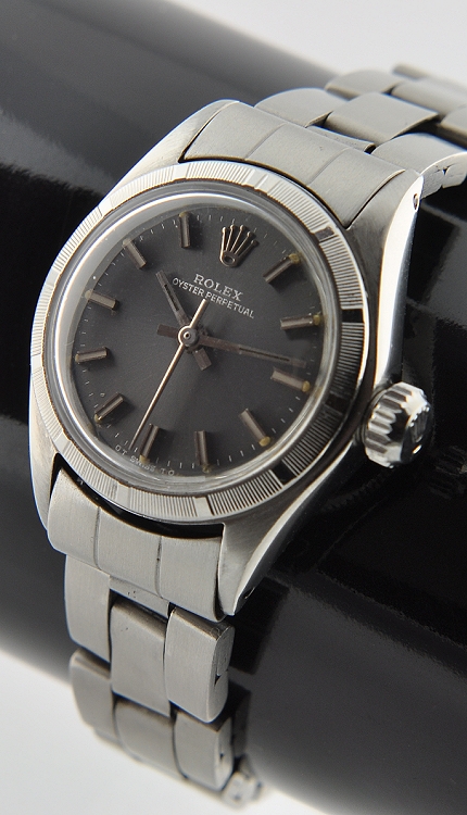 1971 Rolex Oyster Perpetual stainless steel watch with original slate-grey dial, scratchless case, engine-turned bezel, and clean movement.