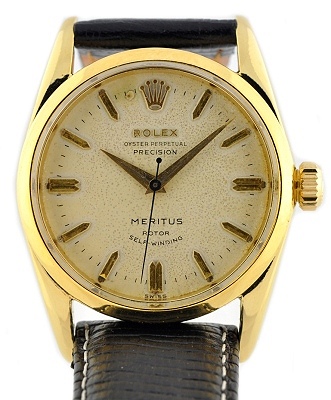 1956 Rolex Oyster Perpetual Precision Meritus gold-plated watch with original winding crown, Dauphine hands, and caliber 1030 movement.