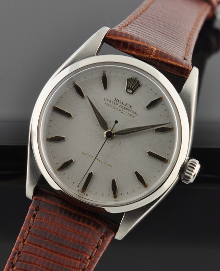 1955 Rolex Oyster-Perpetual Metropolitan stainless steel watch with original two-tone dial, Dauphine hands, and cleaned automatic movement.