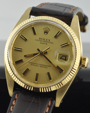 1979 Rolex Oyster Perpetual Date 14k solid-gold watch with original case, fluted bezel, baton hands, markers, and caliber 1570 movement.