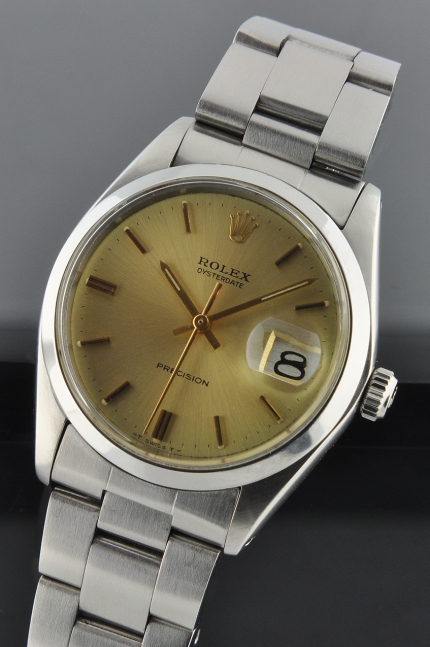 1971 Rolex Oysterdate Precision stainless steel watch with original gold dial, baton hands, markers, case, and manual winding movement.