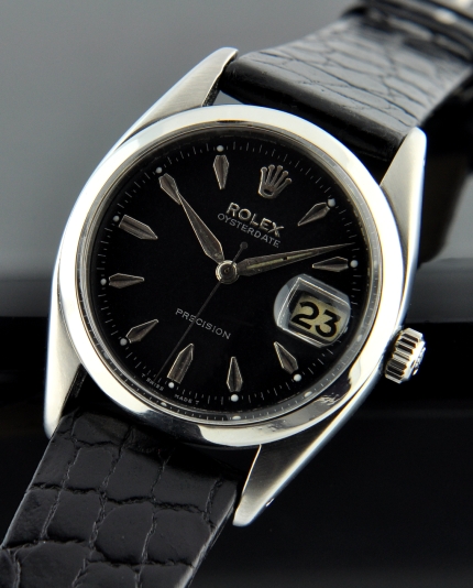 1959 Rolex Oysterdate Precision stainless steel watch with original roulette date aperture, restored black dial, and clean manual movement.