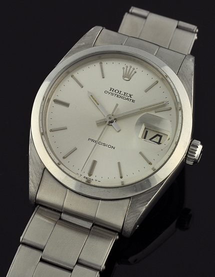 1967 Rolex Oysterdate Precision stainless steel watch with original case, tight riveted bracelet, silver dial, and manual winding movement.