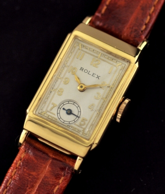 1940s Rolex gold-filled watch with original case, restored dial, Arabic numerals, signed case, and clean, accurate manual winding movement.