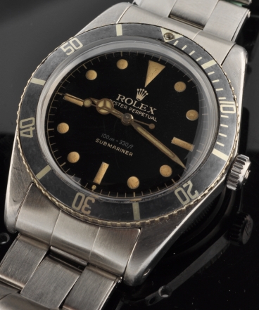 1962 Rolex Oyster Perpetual Submariner stainless steel watch with original glossy black dial, exclamation dot marker, and unpolished case.