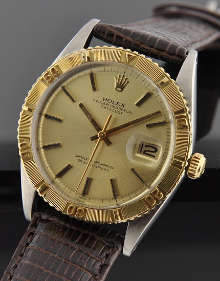 1971 Rolex Oyster Perpetual Datejust stainless steel watch with original gold thunderbird bezel, dial, hands, and clean automatic movement.