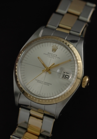 1971 Rolex Oyster Perpetual Date gold and steel watch with original bezel, riveted bracelet, dial, and caliber 1570 automatic movement.