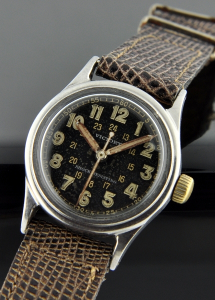 Rolex Victory stainless steel WW2 pilot's watch with original ID case, restored silver dial, pencil hands, and manual winding movement.